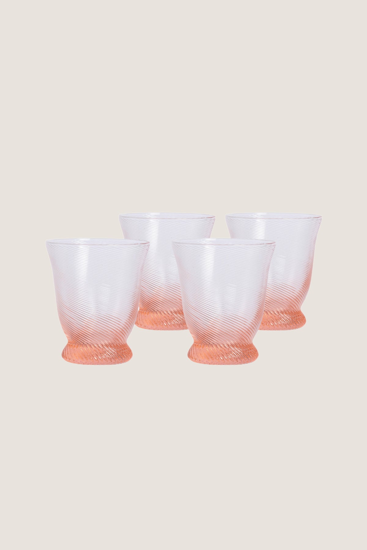 Peony Pink Spiral Tumbler (Set of 4), featuring classic rib-patterned, swirled texture with a flared silhouette, offers an effortless, high-end touch to any fun tablescape.