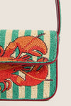 Summer Lobster Tommy Bag: A classic, high-end beaded clutch with red leather trim, featuring an effortless, fun lobster design in orange and red hues.