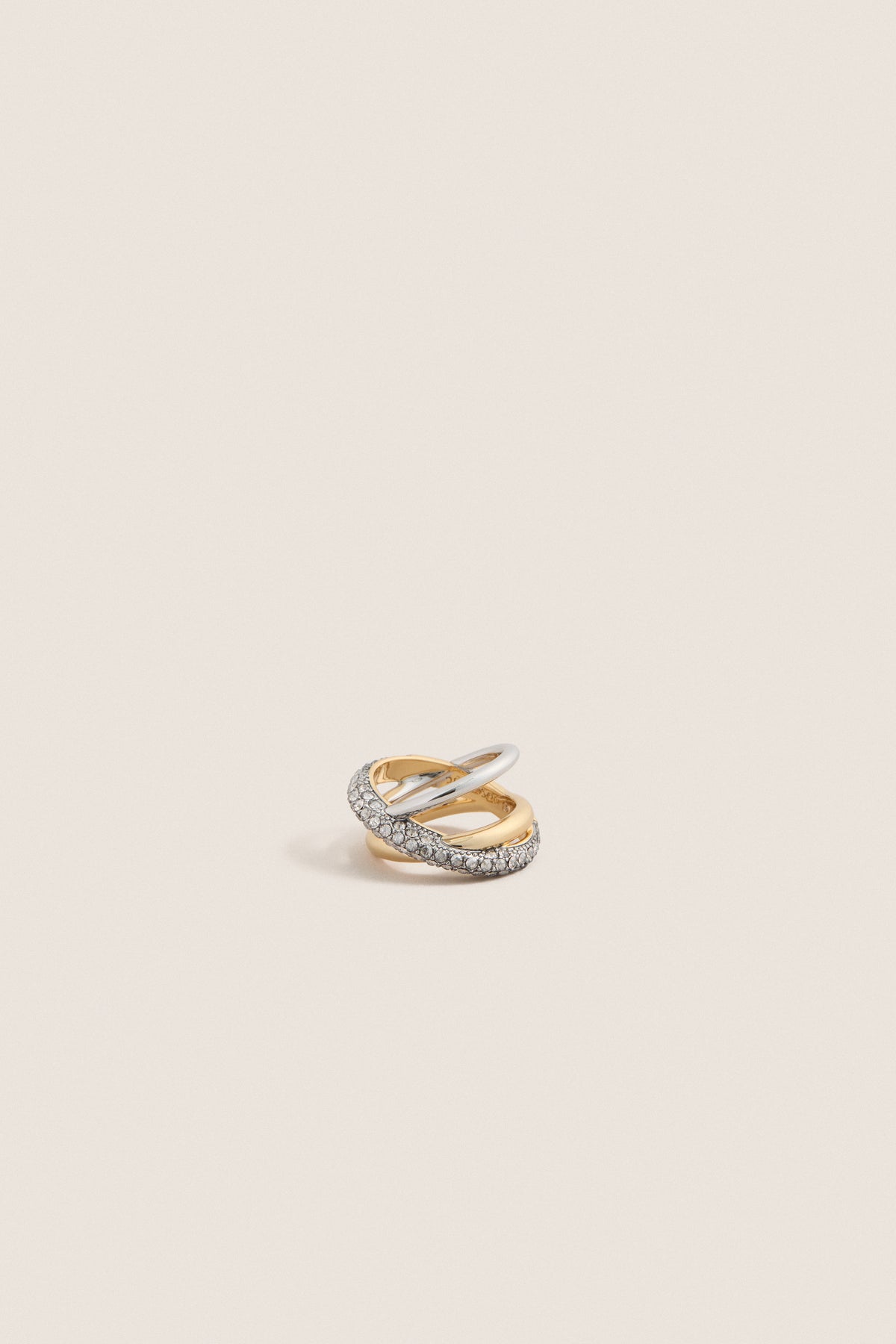 Gold Aya Pinky Ring: A classic, high-end design featuring interwoven yellow gold and white metal bands, with pavé-set stones, offering an effortless and fun elegance.