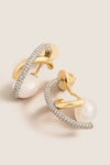 Gold Waverly Earrings: Classic gold-tone hoops adorned with pavé-set crystals, featuring an effortless dangling pearl, exuding a high-end, fun style.