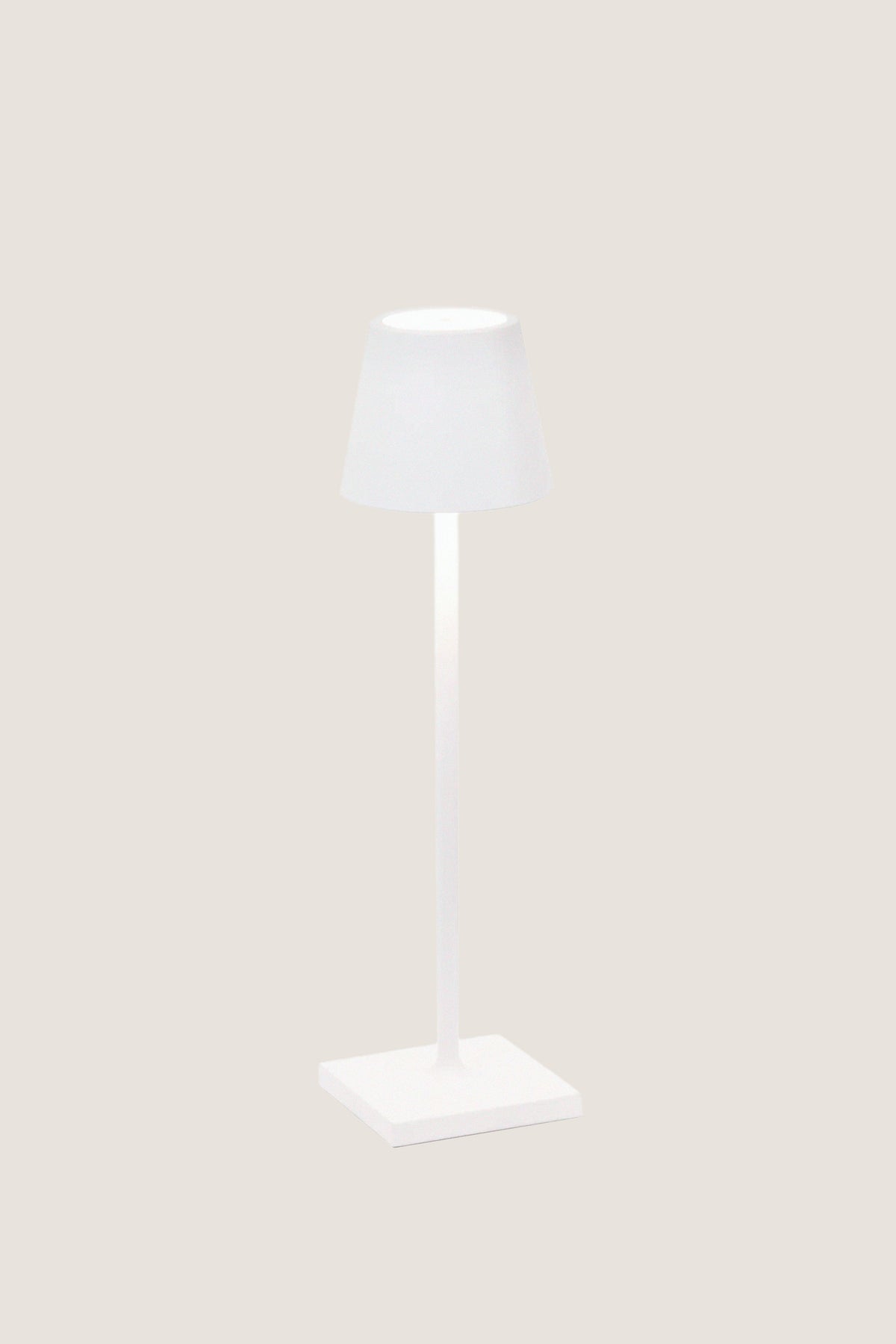 White Poldina Pro Table Micro Lamp with a classic, modern design; features touch control, dimmable LED, and cordless use, perfect for effortless indoor or outdoor illumination.