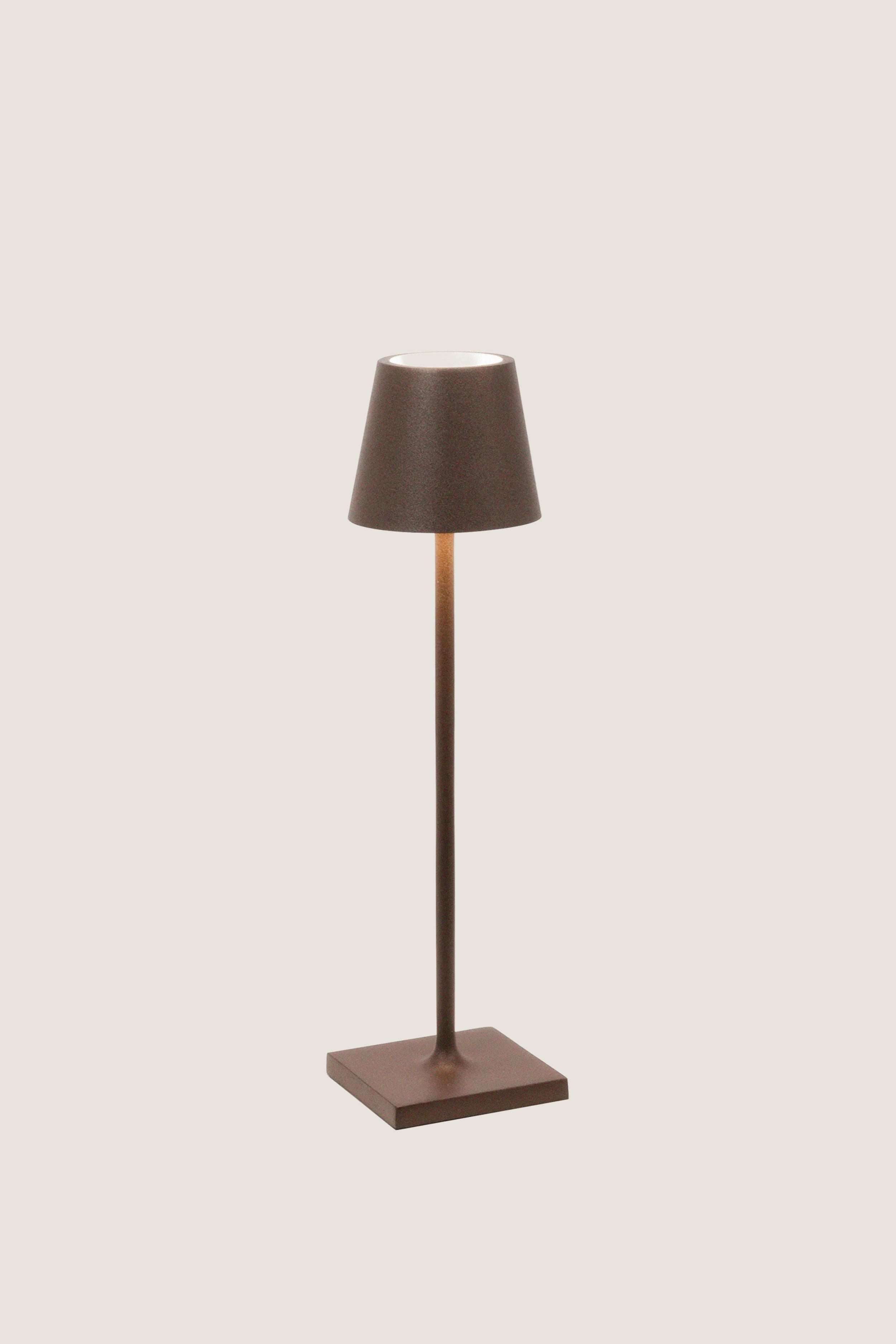 Rust Poldina Pro Table Micro Lamp: a classic, effortless cordless lamp with touch control, perfect for indoor/outdoor use. High-end design for fun, versatile lighting.