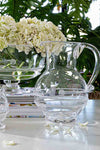 Amalia Glass Round Pitcher with classic bead-and-rope motif, epitomizing effortless elegance. Perfect for fun gatherings, showcasing high-end craftsmanship in mouth-blown glass.