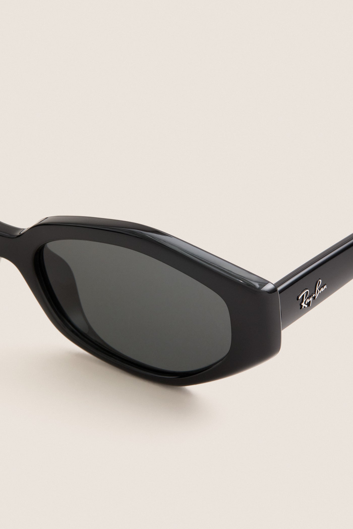 Black RB4473D Sunglasses: classic cat-eye design with Ray-Ban logo on temple, offering an effortless, high-end style perfect for fun, confident looks.