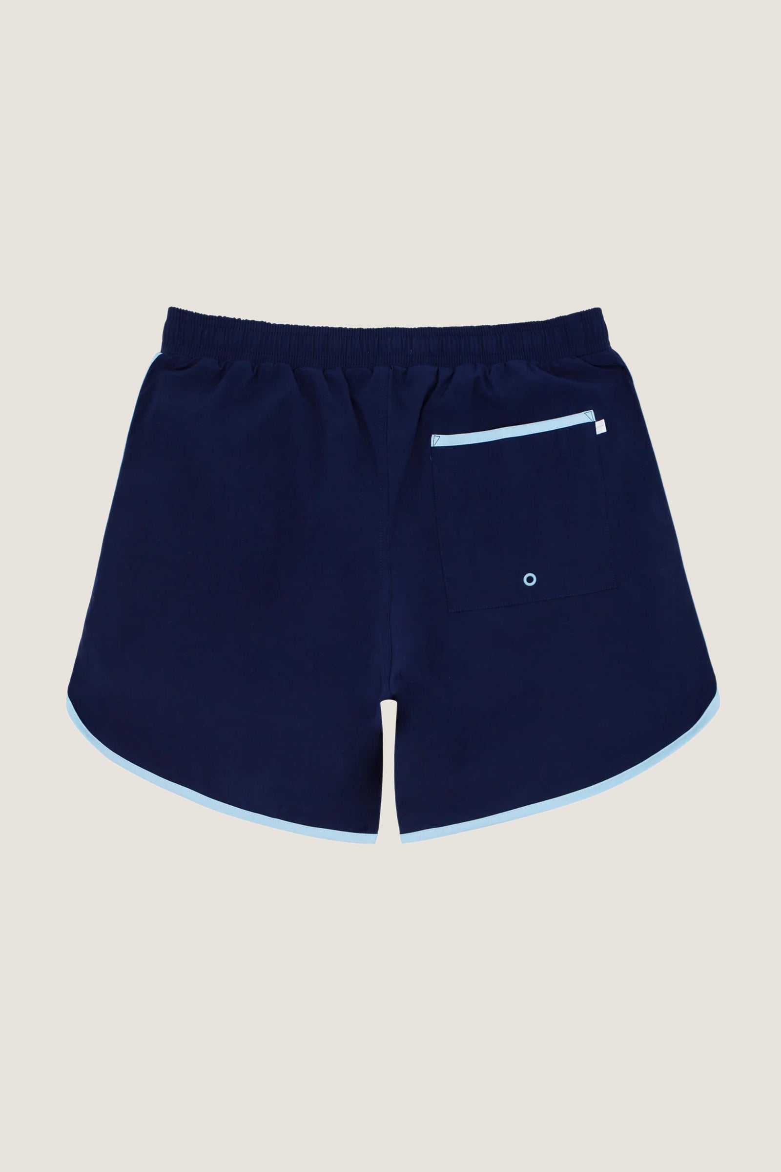 Navy Boardie swim trunks, classic and effortless, feature an elastic drawstring waist, side pockets, and a back patch pocket. High-end design for fun, all-day comfort. 