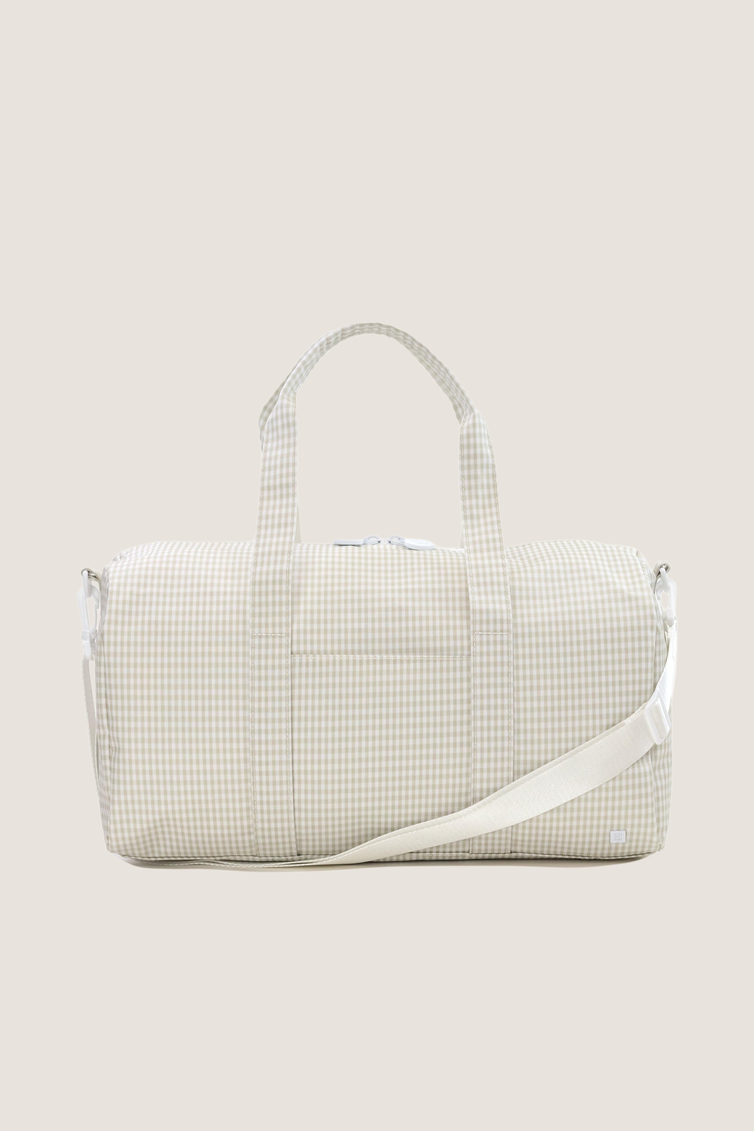 Gingham Pearl Grey Weekender Duffel Bag with classic gingham pattern, top handles, and detachable shoulder strap. Effortlessly combines fun, high-end design with practical features.
