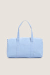 Gingham Sky Weekender Duffel Bag in light blue gingham pattern, featuring a classic, effortless design with dual handles and a playful, high-end feel.