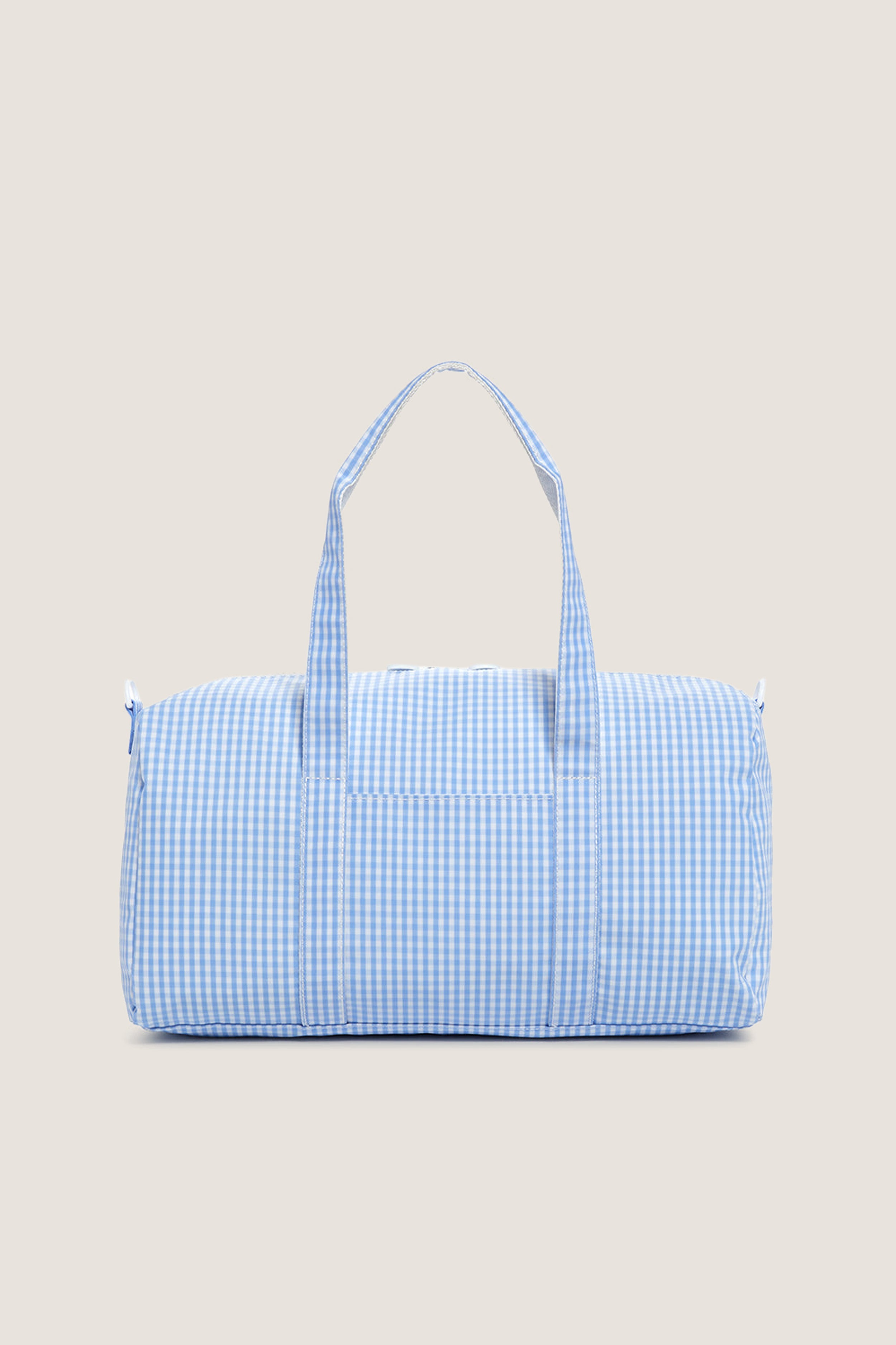Gingham Sky Weekender Duffel Bag in light blue gingham pattern, featuring a classic, effortless design with dual handles and a playful, high-end feel.