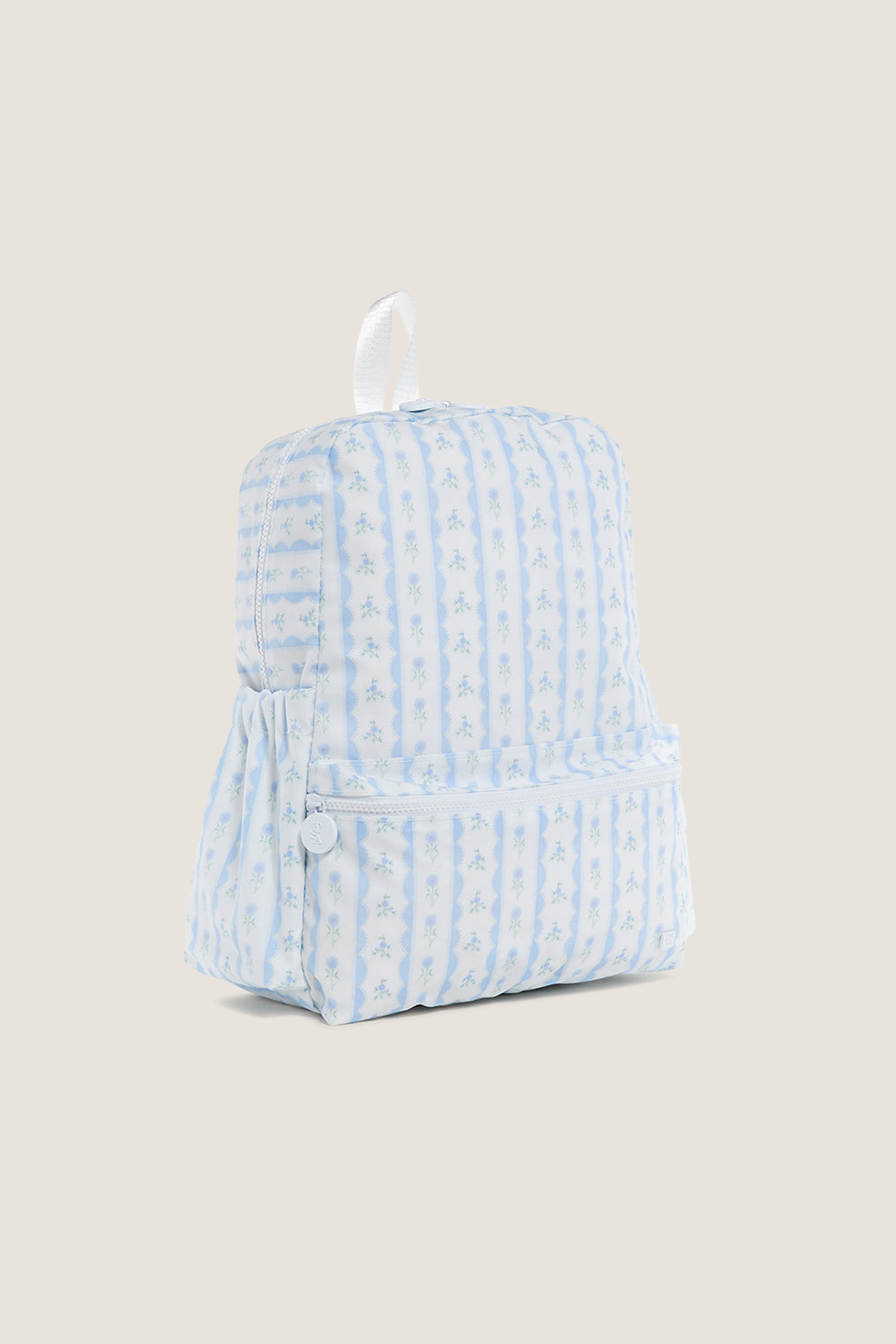 Floral Blue Ribbon Backpack with classic pale blue and white stripes, featuring tiny floral motifs, front zippered pocket, and elastic side pocket for an effortless, high-end look.