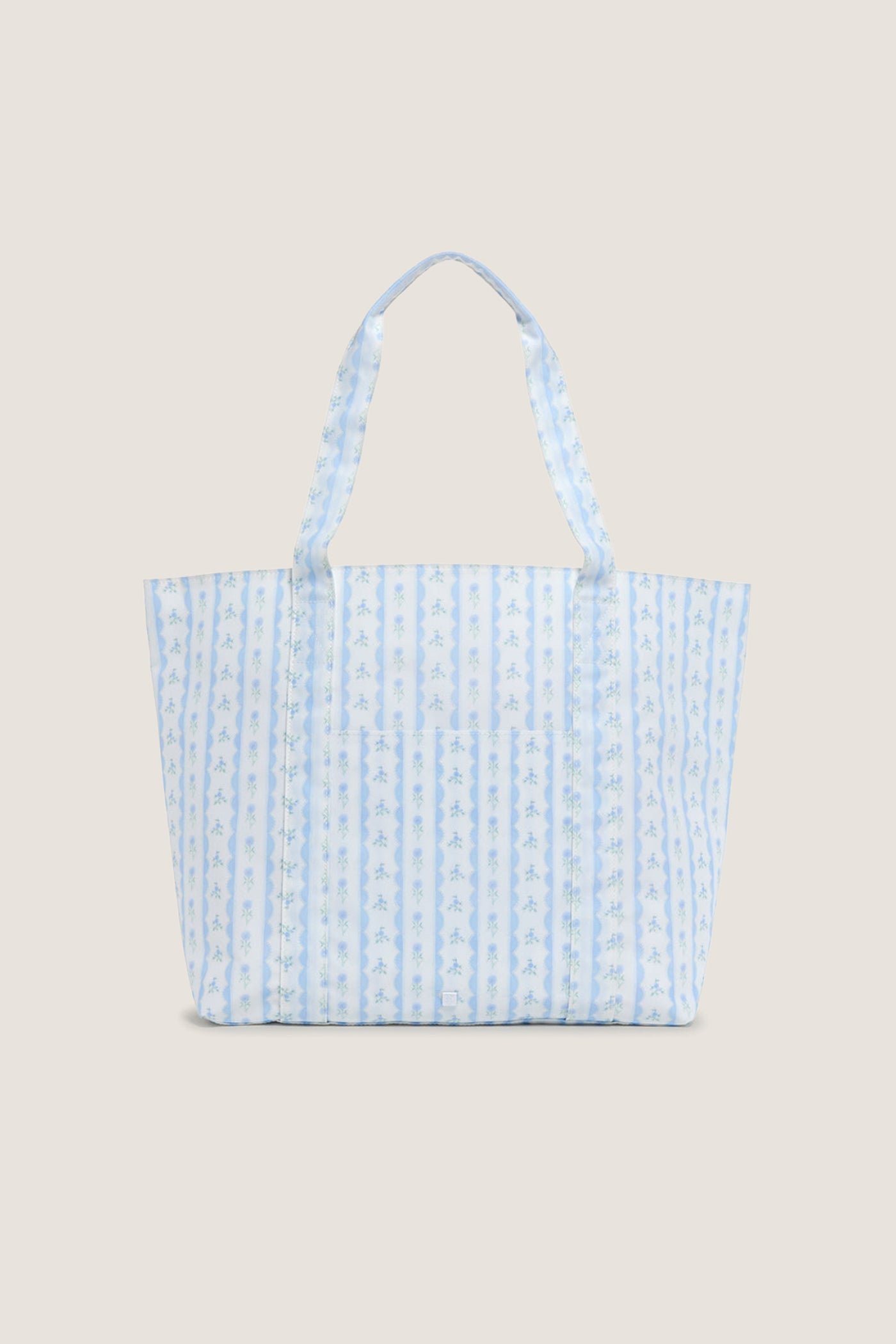 Floral Blue Ribbon Jumbo Tote features classic blue-and-white stripes with floral motifs, offering an effortless, high-end touch to your fun, everyday carry-all needs.