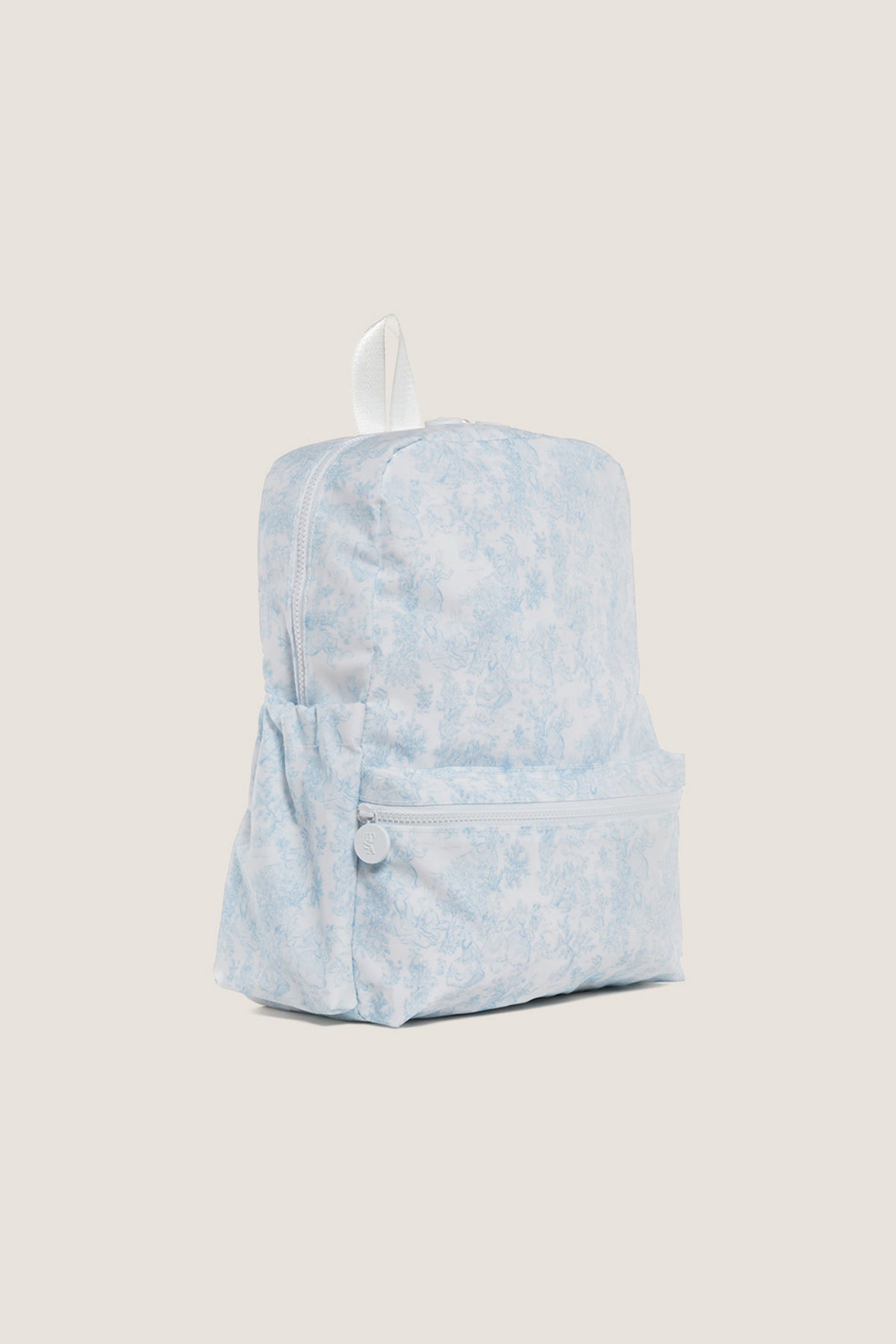 Blue Bunny Toile Backpack, a classic, high-end, and effortless design featuring a fun toile pattern, adjustable padded straps, roomy compartments, and elastic side pockets for practical, stylish use.