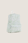 Green Bunny Toile Backpack with classic toile pattern, effortless design featuring a zippered main compartment, front zip pocket, side pockets, and a fun white carry loop.