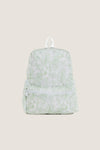 Green Bunny Toile Backpack with a classic toile-style pattern, featuring an effortless, fun design with a small zippered front pocket and white accents, perfect for high-end everyday use.