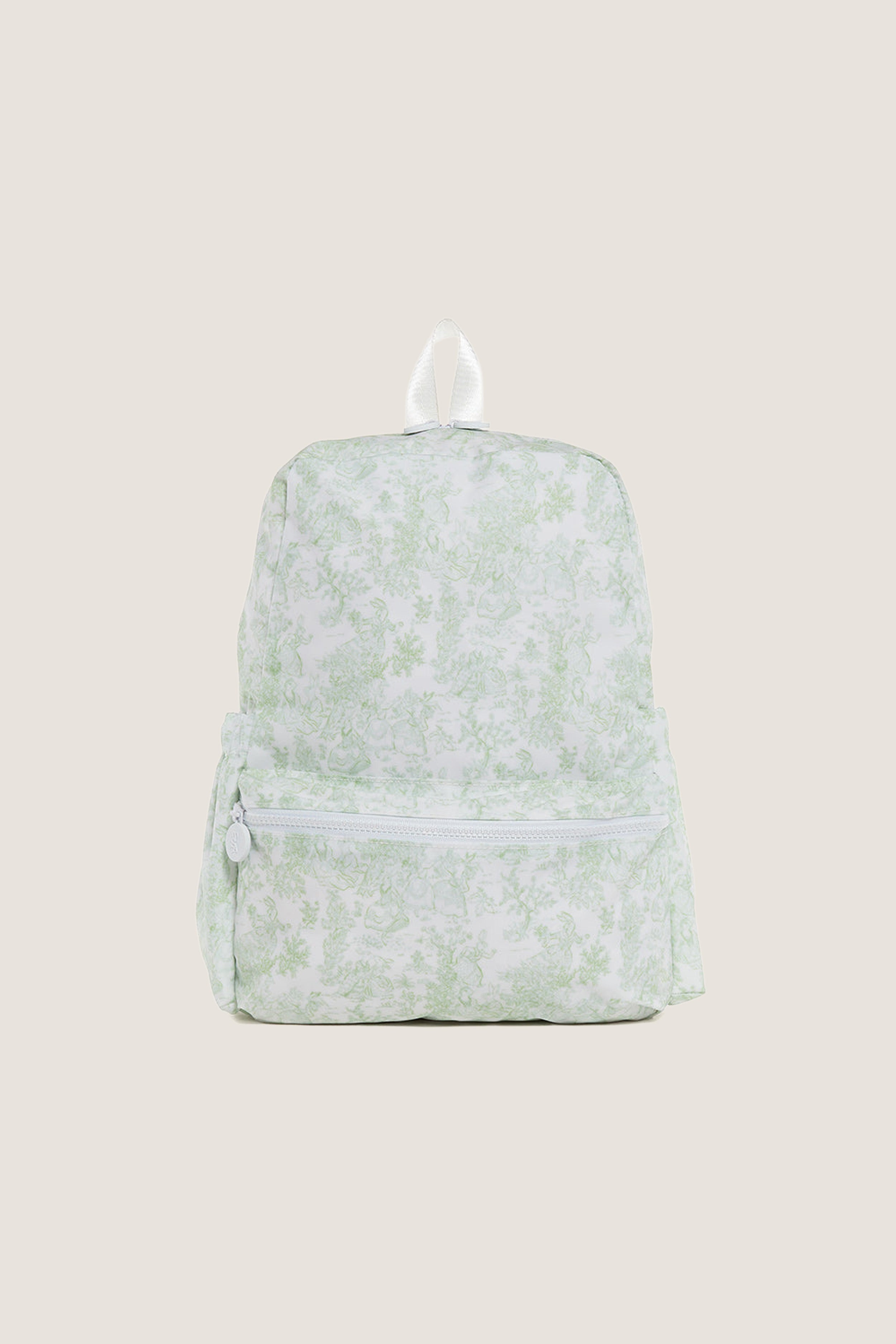Green Bunny Toile Backpack with a classic toile-style pattern, featuring an effortless, fun design with a small zippered front pocket and white accents, perfect for high-end everyday use.
