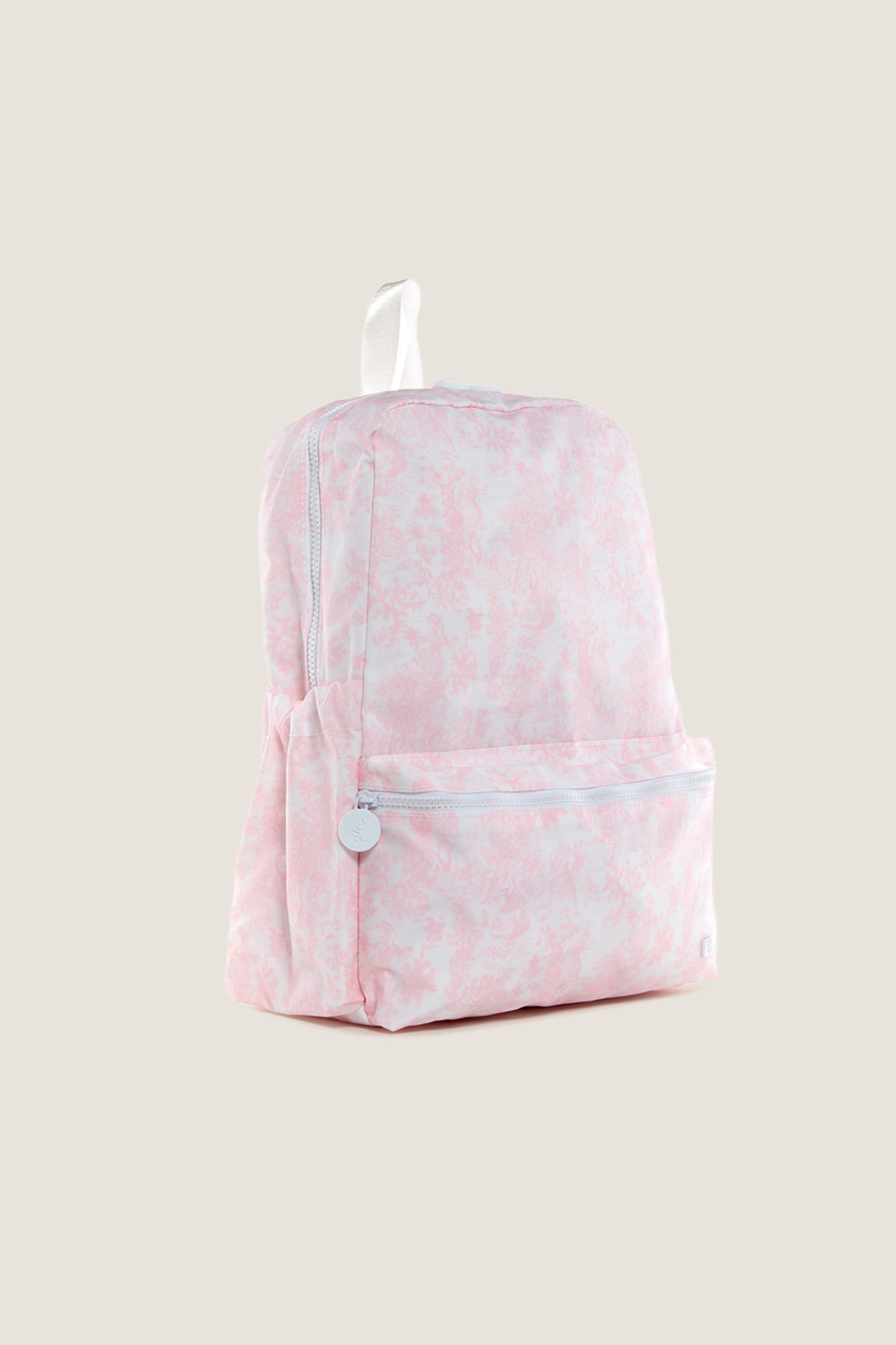 Pink Bunny Toile Backpack with classic design features an effortless zippered main compartment, fun front pocket, side pockets, and a high-end white top carry-handle.