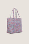 Garden Floral Jumbo Tote featuring a classic, high-end floral print with dual straps for effortless, fun versatility and a wide base for upright stability.