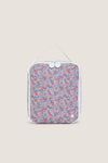 Garden Floral Lunchbox: A classic, high-end zip-around pouch with a carry strap, featuring an effortless, fun floral print. Ideal for organizing travel essentials with ease.