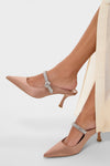 Mocha Satin Mae Heels: Classic nude-pink satin mules with a pointed toe, kitten heel, and sparkling rhinestone strap, embodying effortless, high-end style for fun occasions.