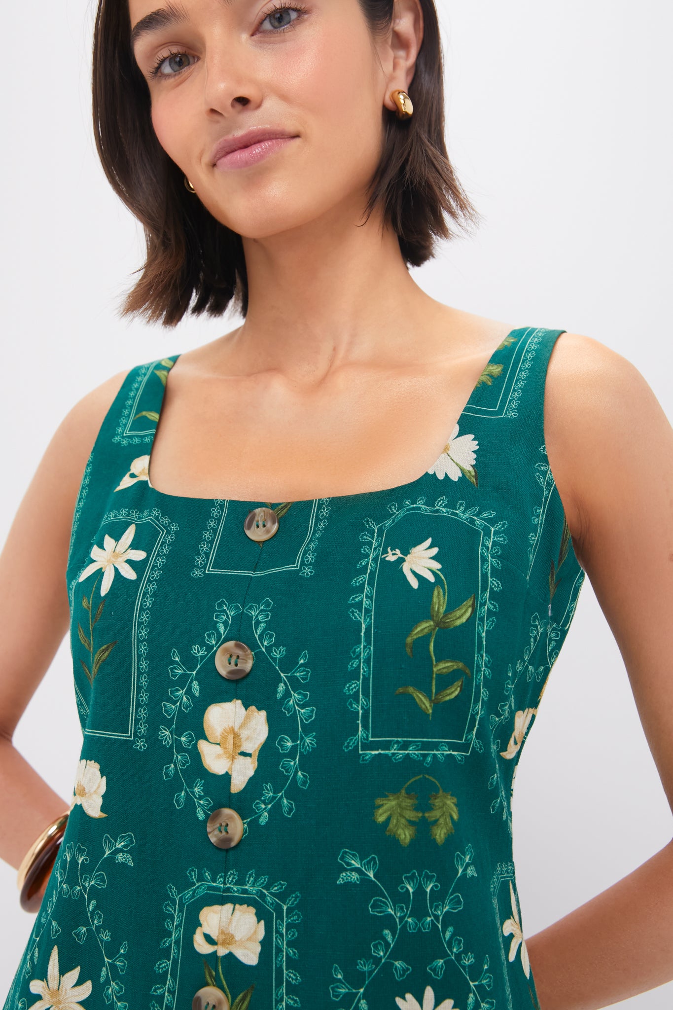 Teal Stem Merrit Mini Dress featuring a classic square neckline, effortless faux button detail, and fun tortoiseshell-look buttons, paired with chunky gold hoop earrings.
