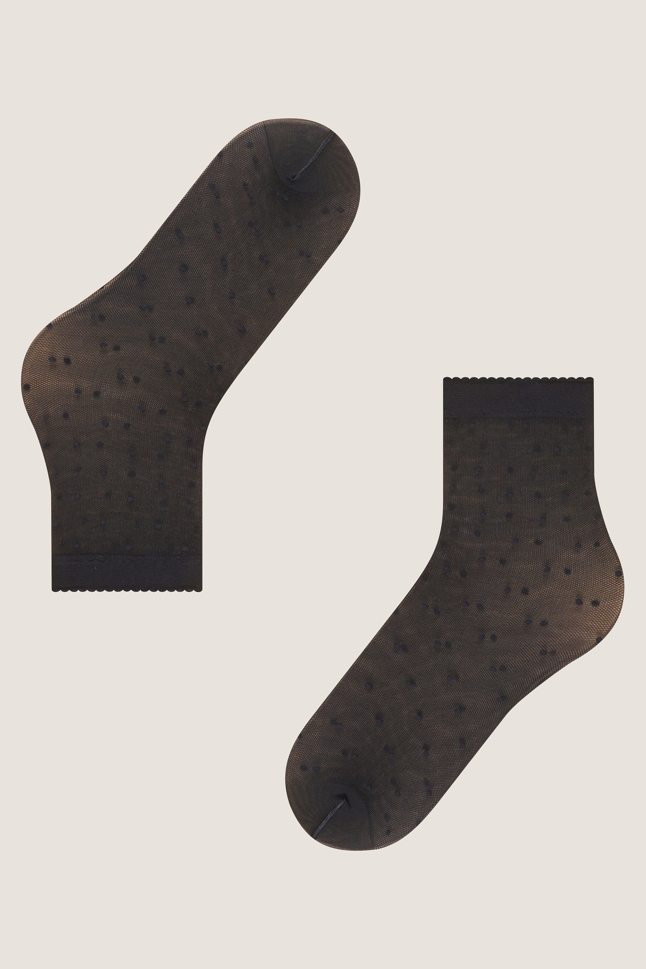 Black Sheer Polka Dot Socks with scalloped cuffs and tiny dot pattern, offering an effortless, fun, and high-end look for any outfit.