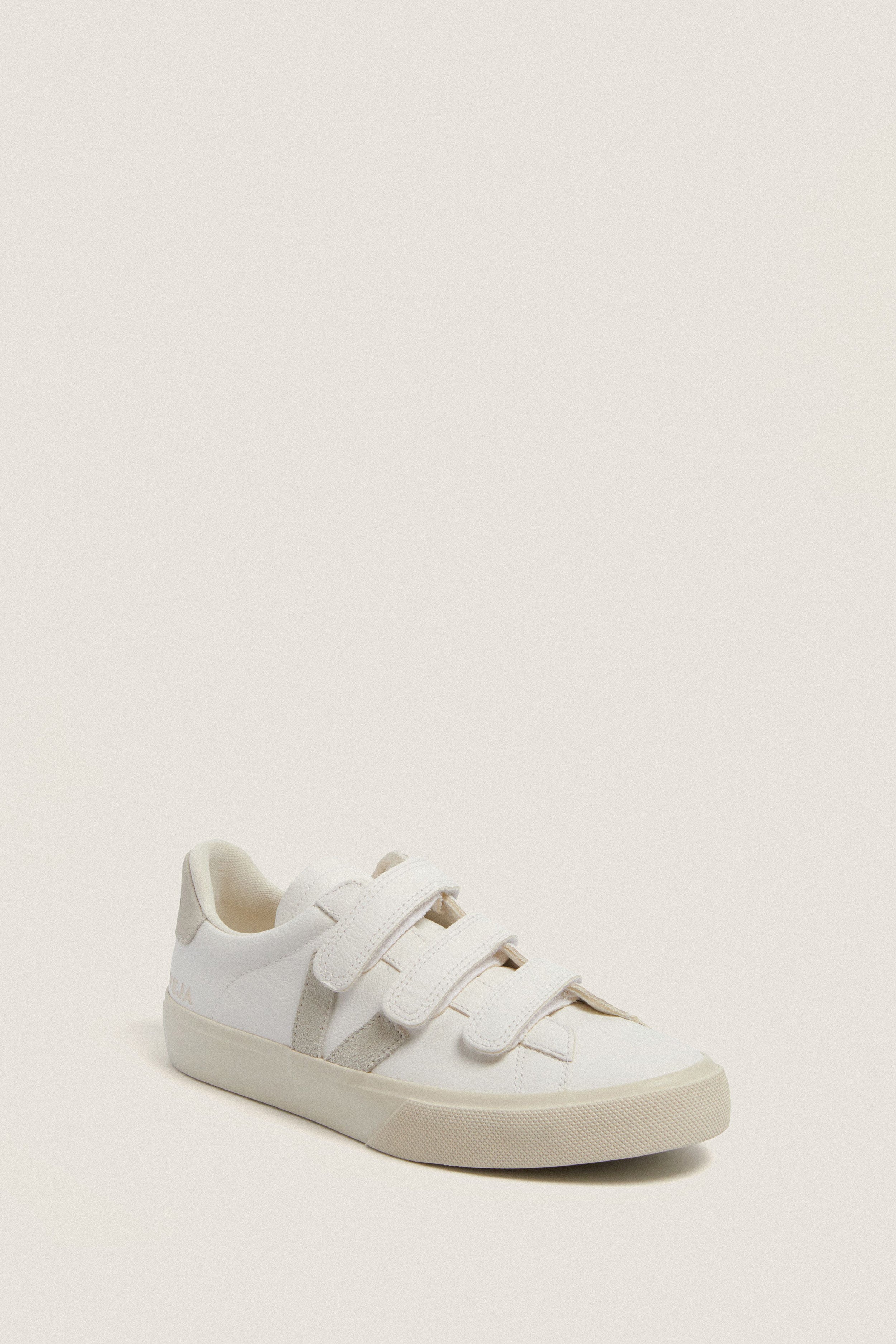 Extra White Natural Recife Sneakers with classic low-top design, effortless Velcro straps, and fun suede logo detail, showcasing high-end craftsmanship and sustainable materials.