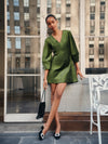 Green Velvet Mayson Dress exudes classic elegance with its A-line silhouette and luxe fabric, paired effortlessly with a chic black pouch and embellished flats.
