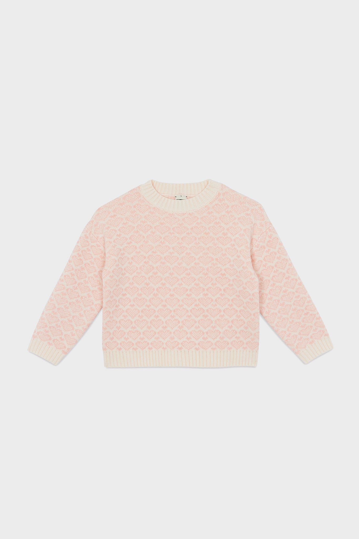 A light pink knit Pink Heart Sweater with a textured diamond pattern and cream ribbed trim from Bonton—perfect for kids’ wardrobes.