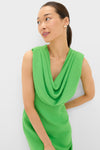 Woman in a bright green Yuri Gown with a cowl neckline, showcasing classic elegance. The dress features a tailored, high-end silhouette, perfect for effortless, fun styling.