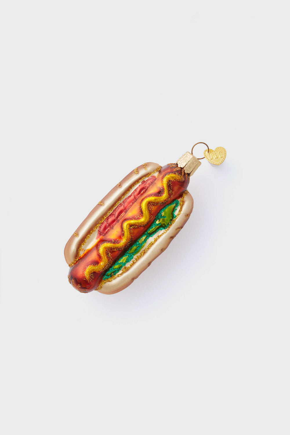 Classic Hot Dog Ornament: A fun, hand-painted glass piece with mustard and relish details, exuding effortless charm and high-end craftsmanship for a festive touch.