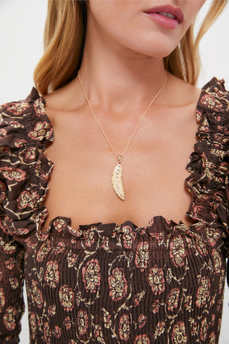 Gold Lucky Feather Pendant, a classic, high-end necklace with a delicate 14k gold-plated feather charm, adding effortless elegance and fun to any outfit.