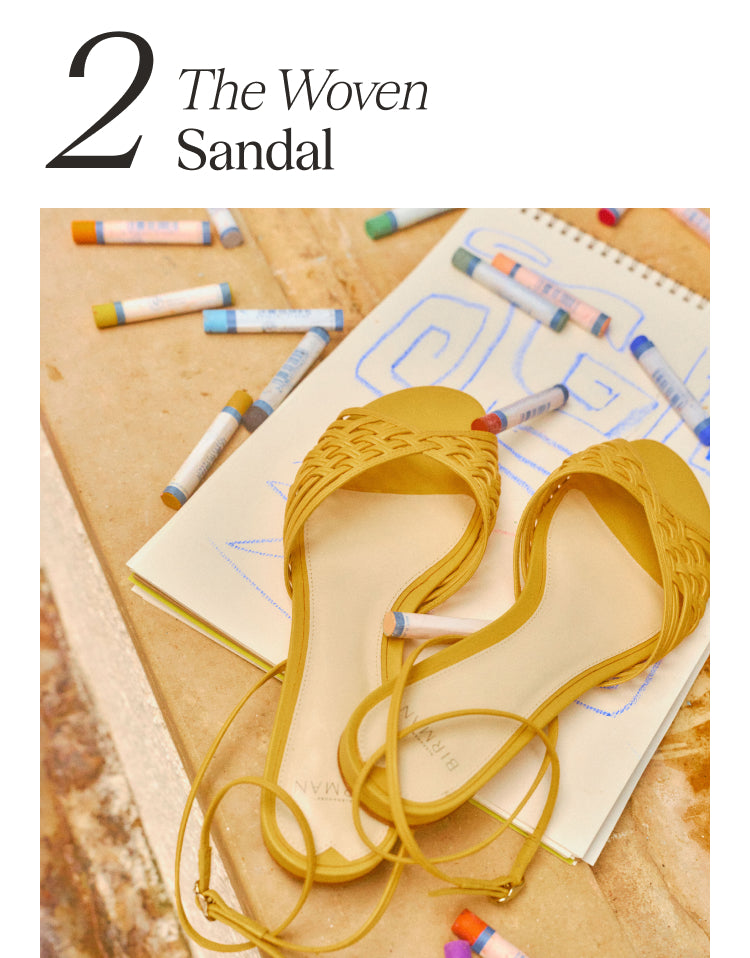 2 The Woven Sandals. A pair of sandals sitting on top of a piece of paper with pastels. 