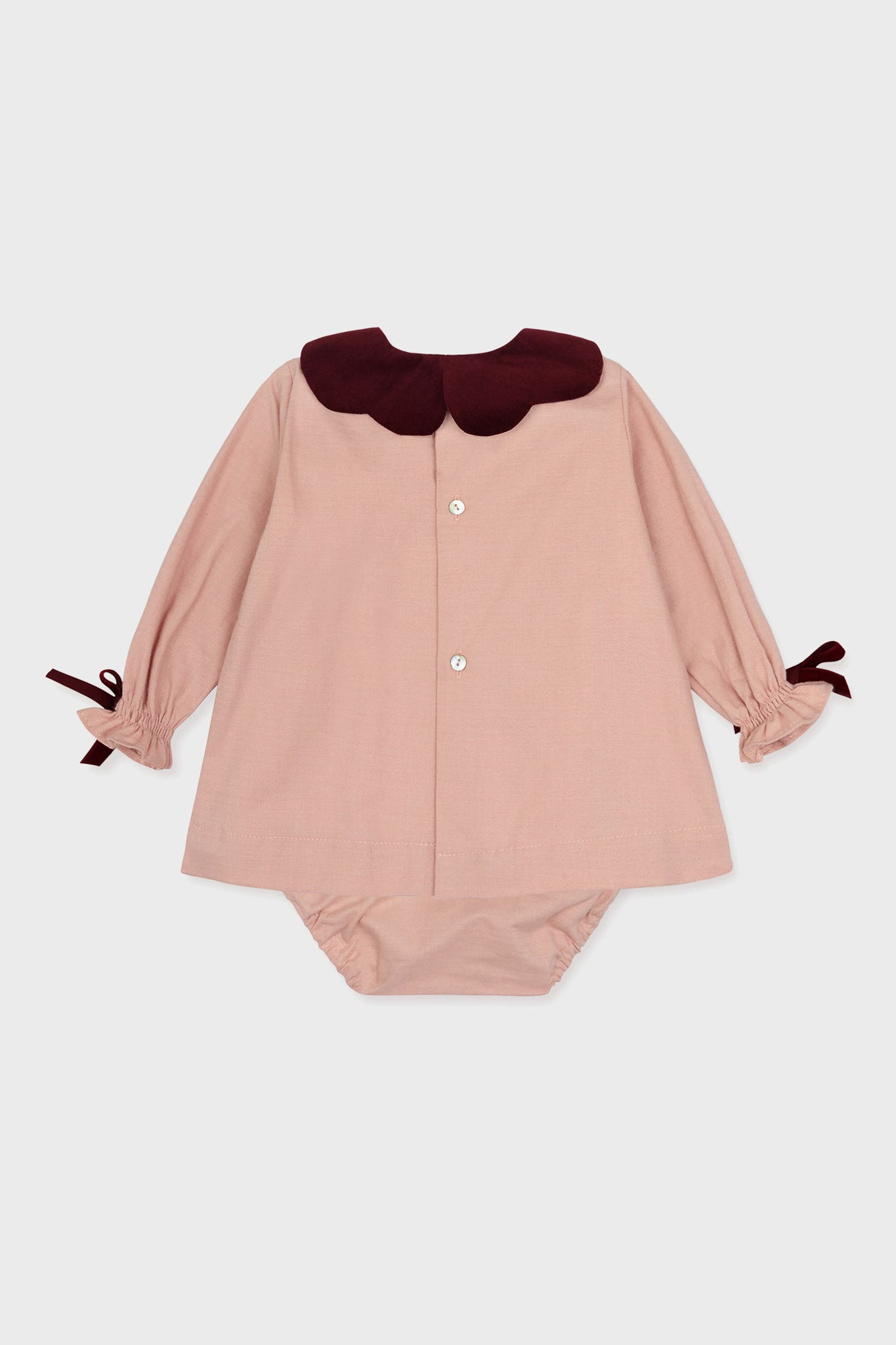 Pink Julieta Baby Girl Set: Classic two-piece with an A-line tunic featuring a scalloped burgundy collar, velvet bow cuffs, and matching bloomers. Effortless, fun, and high-end style.