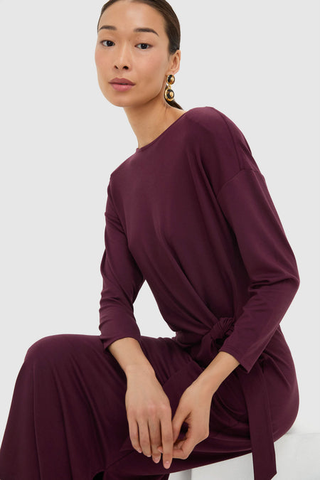 Model in a classic Winetasting Side Tie Elspeth Maxi Dress, showcasing effortless elegance with a faux wrap and statement earrings, epitomizing high-end, fun style.