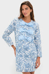Woman modeling the Blue Chintz Clarice Bows Dress, featuring a classic shift silhouette with elegant bows and a floral pattern, embodying effortless, high-end, and fun fashion.