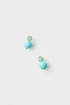 A pair of turquoise bead earrings, with one small aventurine bead and a larger bead on each nickel-free stud.