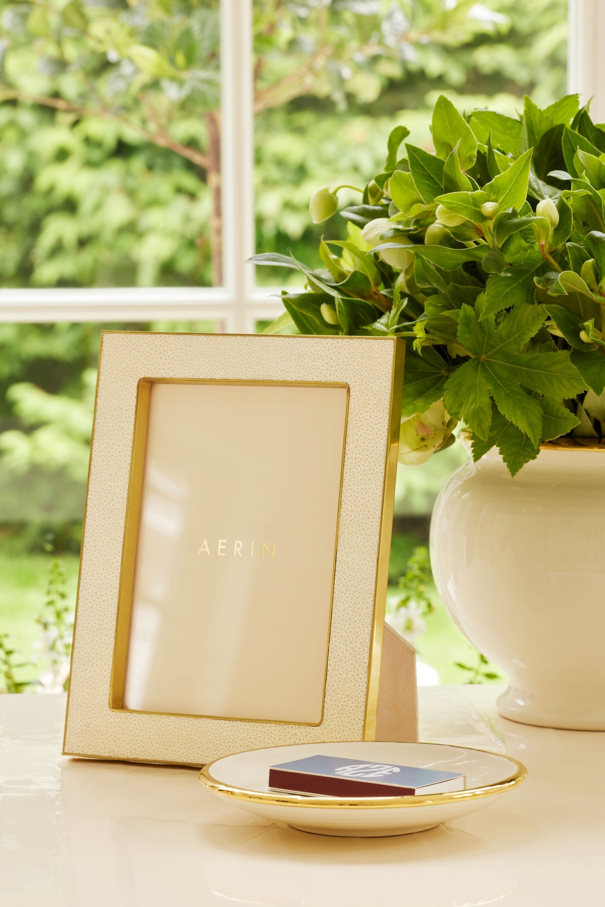 5x7 Cream Classic Shagreen Frame: A high-end, effortlessly classic frame with embossed shagreen and polished brass, elegantly displaying art or photos, embodying AERIN's luxury lifestyle.
