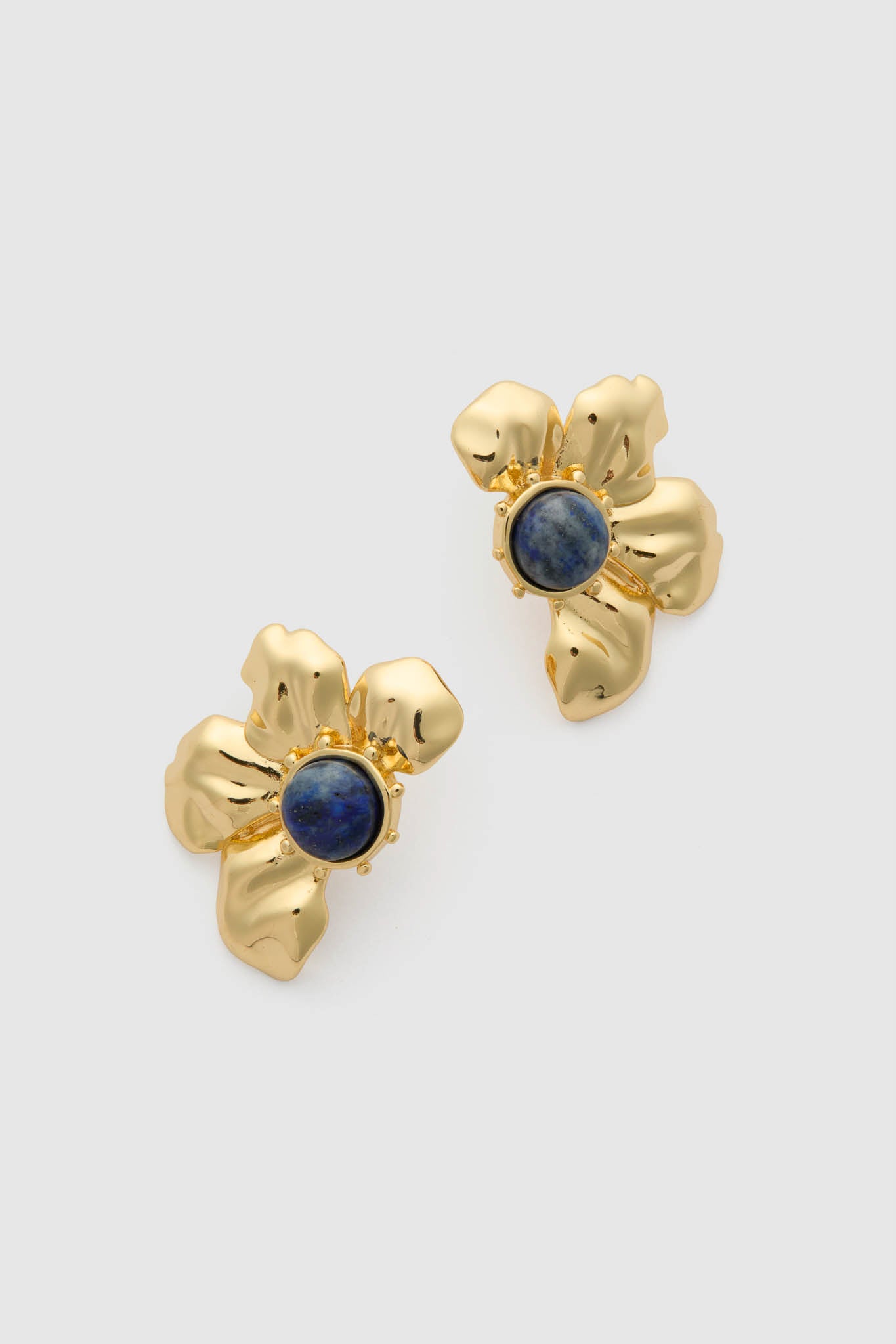 Gold Multi Lelani Stud Earrings feature classic, flower-shaped gold petals with a deep-blue lapis center, offering an effortless, high-end touch to any look.