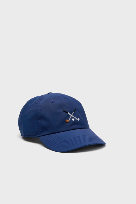 A blue Smathers and Branson needlepoint hat with embroidered crossed golf clubs and ball on the front—perfect for any golf lover.
