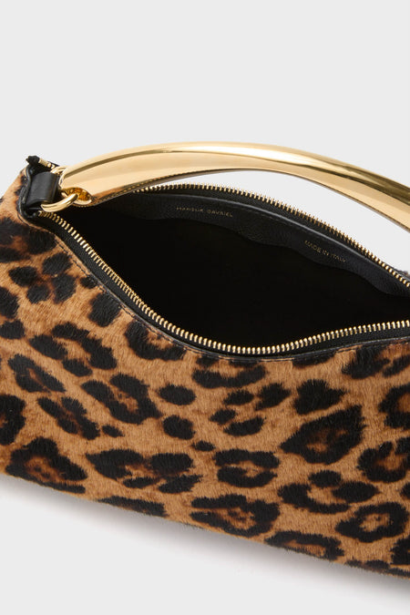 Leopard Metal Handle Rhea Bag: A classic, effortless designer handbag with a leopard-spot finish, polished gold-tone handle, and sleek zip closure. High-end Italian craftsmanship for fun, stylish outings.
