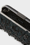 Black Beth Encrusted Clutch: A classic, high-end minaudière adorned with beaded embellishments, pearls, and crystals, offering an effortless, fun accessory for formal occasions.