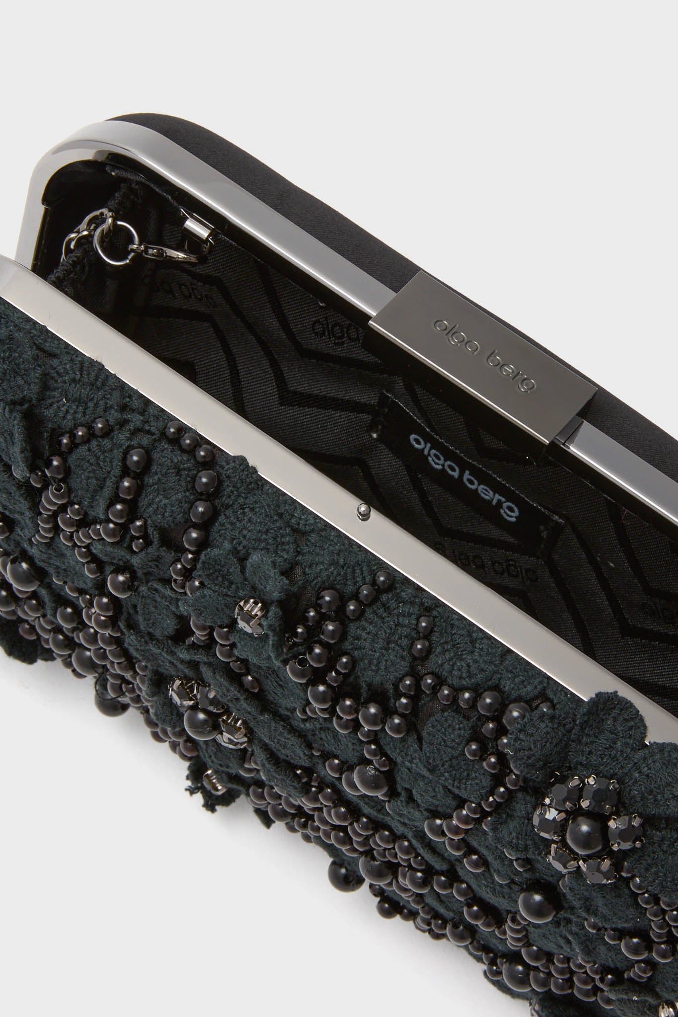 Black Beth Encrusted Clutch: A classic, high-end minaudière adorned with beaded embellishments, pearls, and crystals, offering an effortless, fun accessory for formal occasions.