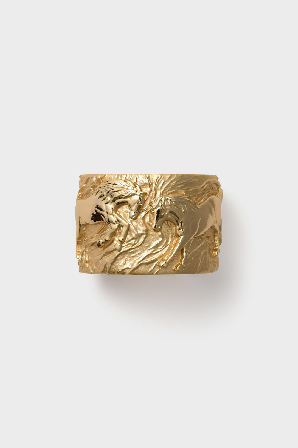 Wide gold ring featuring an embossed design of two horses facing each other, inspired by the Jane Win Gold Courage Horse Cuff.