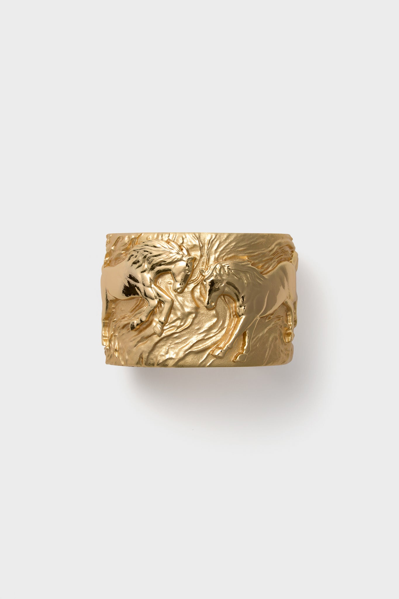 Wide gold ring featuring an embossed design of two horses facing each other, inspired by the Jane Win Gold Courage Horse Cuff.