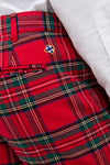 Royal Stewart Tartan Stretch Twill Harbor Pants featuring a classic tartan print; effortlessly stylish, high-end design with embroidered logo above back pocket, paired with a tucked white shirt.