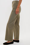 Model wearing classic Olive Sailor Pant, high-waisted with wide-leg and patch pockets, styled with black flats. Effortless, fun, and high-end design.