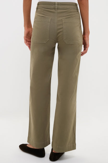 Model wearing ASKK NY's classic Olive Sailor Pant, showcasing its effortless wide-leg design and fun patch pockets, epitomizing high-end, versatile style.