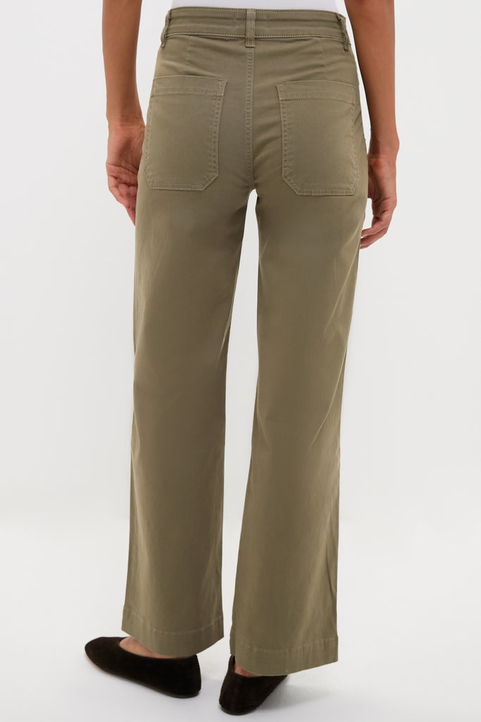 Model wearing ASKK NY's classic Olive Sailor Pant, showcasing its effortless wide-leg design and fun patch pockets, epitomizing high-end, versatile style.