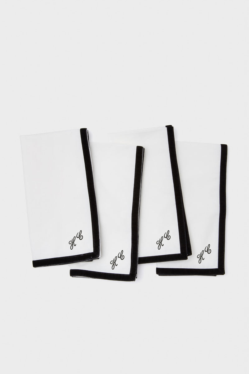 Black Velvet Trim Napkins Set of 4: Classic white cotton napkins with effortless black border and HC monogram. Perfect for adding a fun, high-end touch to any table setting.