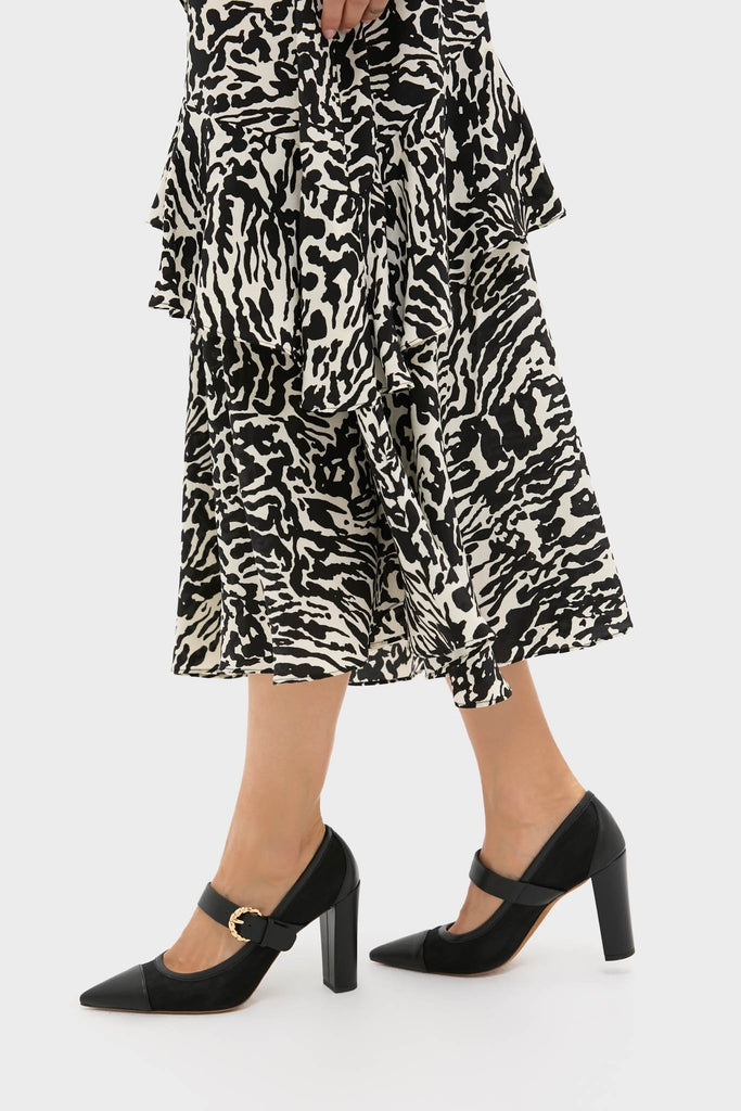 Black Kiki Mesh Buckle Heels with a classic pointed toe and block heel, effortlessly paired with an animal-print skirt, exude high-end, fun style and elegance.