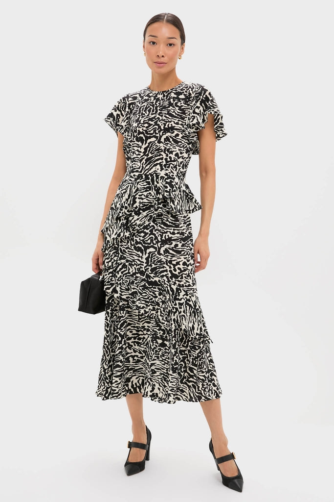 Woman models Black Kiki Mesh Buckle Heels with a classic, effortless style, featuring a pointed toe, block heel, and twisted buckle, epitomizing high-end, fun fashion.